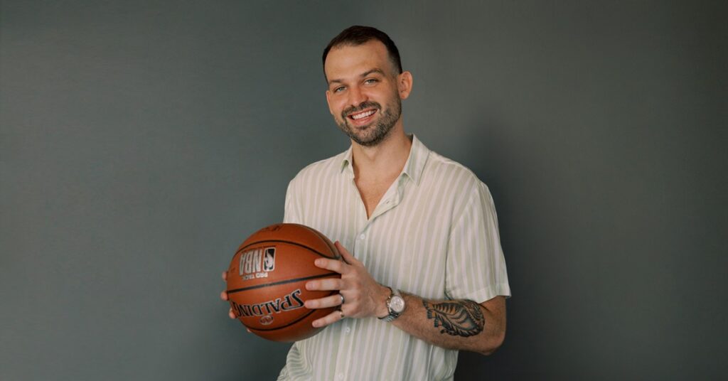 Scott McElroy, executive coach, holding a basketball